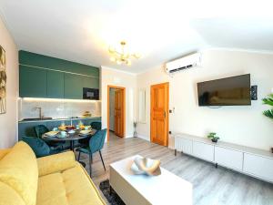 a living room with a couch and a table at Villa Dubelj Dubrovnik - One-Bedroom Apartment - 2 in Komolac