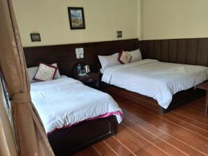 Voodi või voodid majutusasutuse Peacock - a family-run hotel toas
