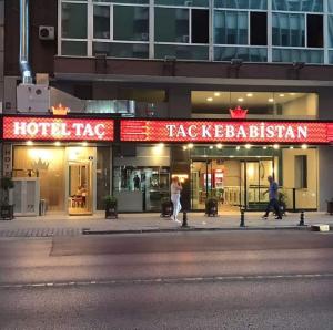 a building with a hot taco restaurant on a city street at Tac Hotel in Ankara