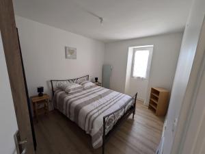 Ένα ή περισσότερα κρεβάτια σε δωμάτιο στο Location appartement