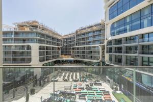 a view of a building from the glass floor of a building at Exquisite Residence in Mercury Towers in St. Julianʼs