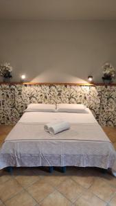 Postel nebo postele na pokoji v ubytování B&B Popoli Terme