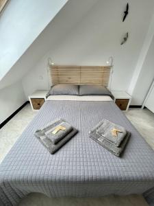 A bed or beds in a room at Entre Montaña y Río Unquera