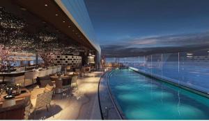 a hotel with a swimming pool in a building at Exquisite Residence in Mercury Towers in St. Julianʼs