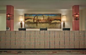 a lobby with a large painting on the wall at Graduate by Hilton Tempe in Tempe