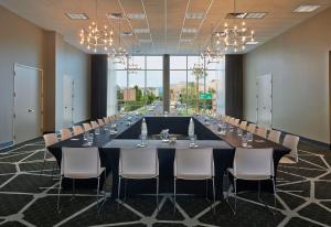 a large conference room with a long table and chairs at Graduate by Hilton Tempe in Tempe