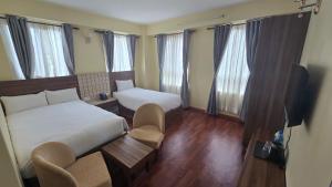 Letto o letti in una camera di Hotel Dolkha Durbar