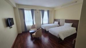 Letto o letti in una camera di Hotel Dolkha Durbar