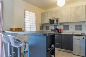 Kuchyň nebo kuchyňský kout v ubytování Appartement Orchid Dan