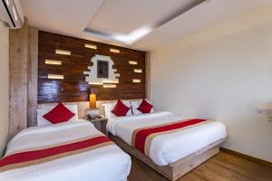 Un pat sau paturi într-o cameră la Hotel Goodwill Patan Durbar Square, Kathmandu