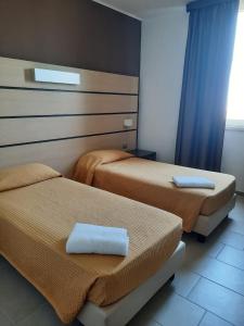 Postel nebo postele na pokoji v ubytování Hotel Verdina