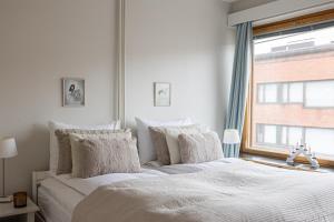 Ένα ή περισσότερα κρεβάτια σε δωμάτιο στο Lapland City Apartment