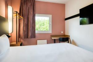 Postel nebo postele na pokoji v ubytování B&B HOTEL Liège Rocourt + 21 fotografií