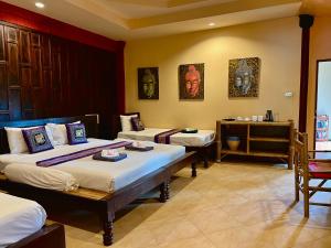 Krevet ili kreveti u jedinici u okviru objekta Baan Ton Rak Boutique Resort +108 fotografija