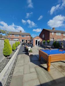 a pool table sitting on top of a patio at Cozy Blackpool Retreat with 3 Bedrooms in Blackpool