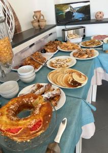 a table with many different types of food on it at Oasi Di Casablanca in Lampedusa