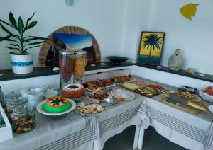 a table with a buffet of food on it at Oasi Di Casablanca in Lampedusa