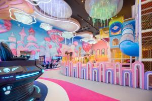 a room with a theme park with a castle at Flamingo Ibiza Hai Tien managed by Flamingo Hotels and Resorts in Nam Khê +111 photos