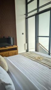 Postel nebo postele na pokoji v ubytování Sujiwa Ubud Hotel & Villa