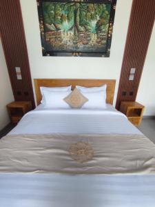 Postel nebo postele na pokoji v ubytování Sujiwa Ubud Hotel & Villa