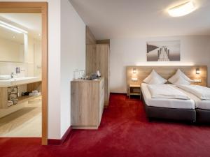 Postel nebo postele na pokoji v ubytování Quality Hosts Arlberg - Haus Pepi Eiter