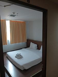 Postel nebo postele na pokoji v ubytování Aloha Budget Hotel hatyai