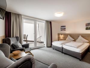 Postel nebo postele na pokoji v ubytování Quality Hosts Arlberg - Haus Pepi Eiter