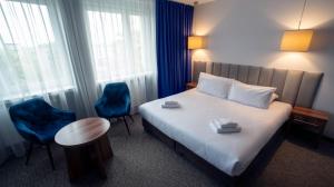 Łóżko lub łóżka w pokoju w obiekcie B&B HOTEL Piotrków Trybunalski