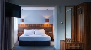 Łóżko lub łóżka w pokoju w obiekcie B&B HOTEL Piotrków Trybunalski