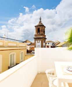 a view from the balcony of a building with a clock tower at Costa by Hawkins Algeciras - Atico in Algeciras