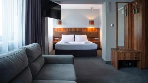 Łóżko lub łóżka w pokoju w obiekcie B&B HOTEL Piotrków Trybunalski