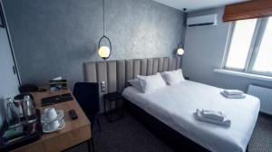 Łóżko lub łóżka w pokoju w obiekcie B&B HOTEL Piotrków Trybunalski