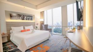 Katil atau katil-katil dalam bilik di HARRIS Suites fx Sudirman