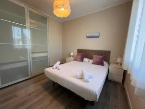a bedroom with a bed with towels on it at RIUS - Apartments & one Penthouse with private terrace in Montjuic in Barcelona