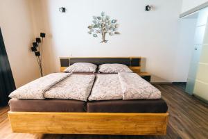 Postelja oz. postelje v sobi nastanitve Apartmány pri Jaskyni - Bystrá