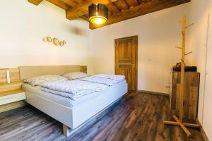 Postelja oz. postelje v sobi nastanitve Apartmány pri Jaskyni - Bystrá
