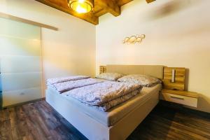 Postelja oz. postelje v sobi nastanitve Apartmány pri Jaskyni - Bystrá