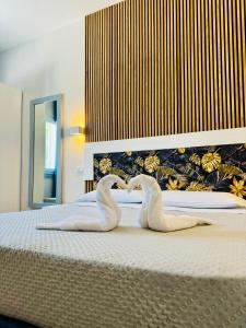 Postel nebo postele na pokoji v ubytování Hotel Lo Scoglio
