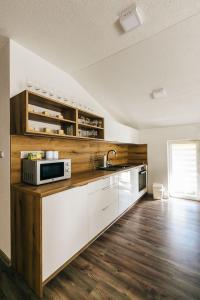 Kuhinja oz. manjša kuhinja v nastanitvi Apartmány pri Jaskyni - Bystrá