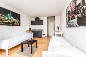 Televisor o centre d'entreteniment de Budget Friendly Apartments Cologne