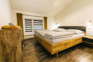 Postelja oz. postelje v sobi nastanitve Apartmány pri Jaskyni - Bystrá