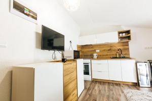 Kuhinja oz. manjša kuhinja v nastanitvi Apartmány pri Jaskyni - Bystrá