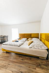 Postelja oz. postelje v sobi nastanitve Apartmány pri Jaskyni - Bystrá