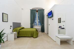 TV a/nebo společenská místnost v ubytování Il Tesoro Smart Suite & SPA