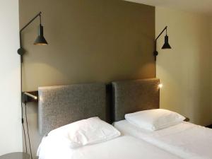 Postel nebo postele na pokoji v ubytování ibis Lille Centre Grand Place