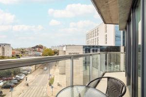 a balcony with a view of a city street at Kilińskiego Prestigious Apartment with Parking by Renters Prestige in Łódź