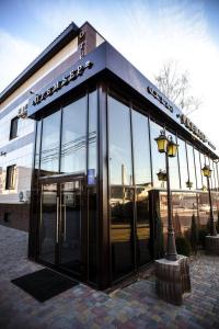 a building with a revolving door and a street light at Premier Hotel in Smolensk