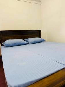 Uma cama ou camas num quarto em Havelock City Hostel, Colombo
