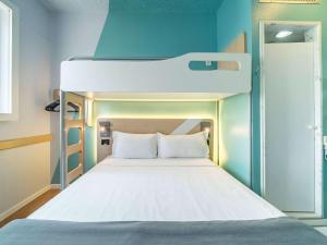 Cama ou camas em um quarto em ibis budget Sao Paulo Jardins