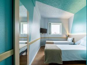 Cama ou camas em um quarto em ibis budget Sao Paulo Jardins mais 37 fotos